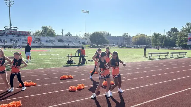 Jr Pacers cheer squad on the sideline
