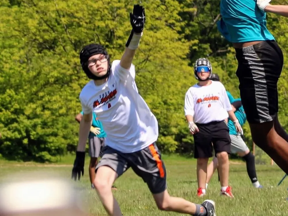 A Jr Pacers 7v7 player sprinting downfield