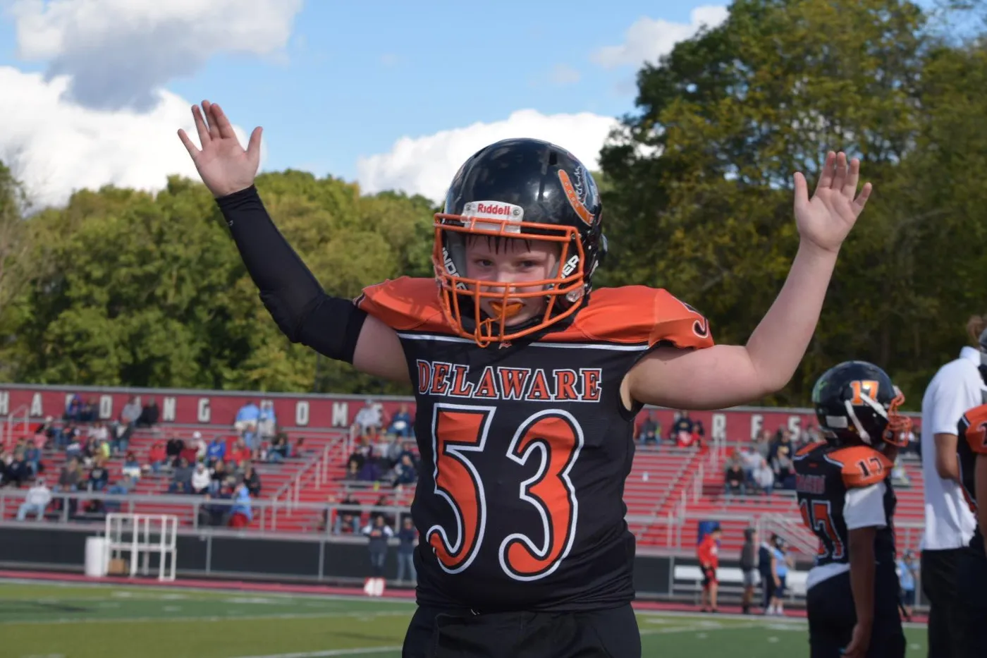 Jr Pacers player celebrating with arms raised