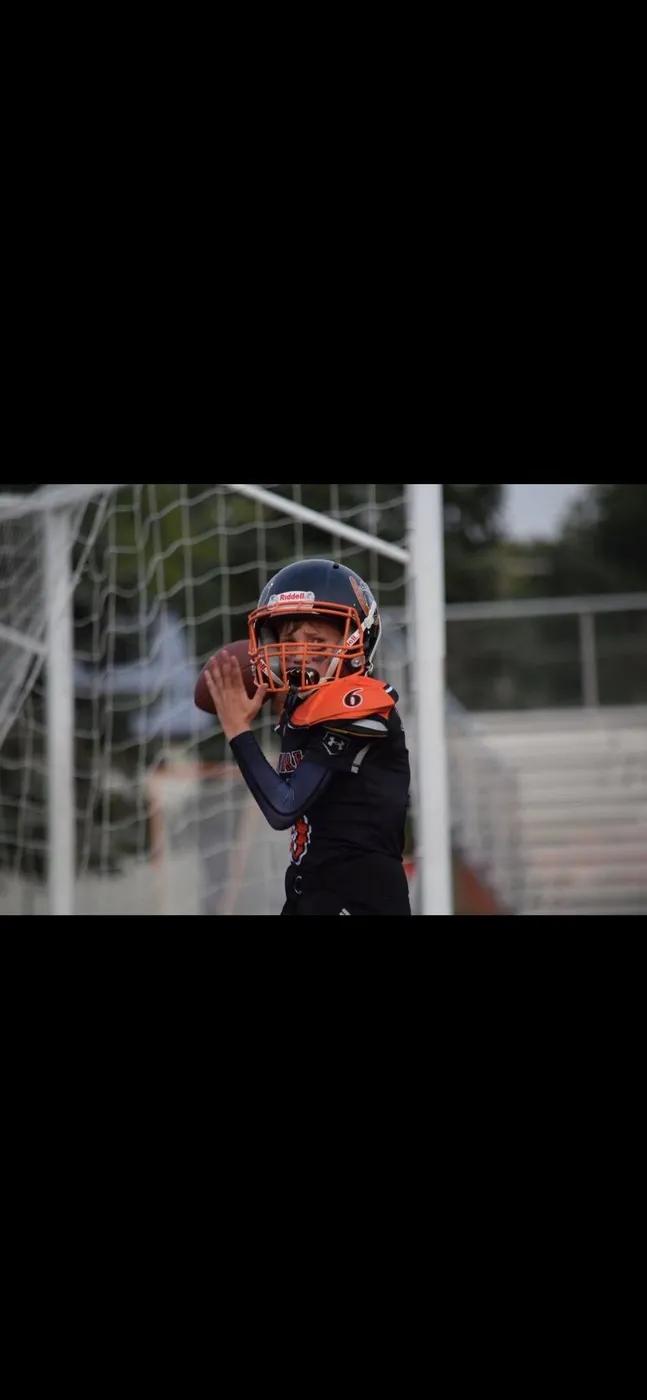 Jr Pacers player celebrating under the goalpost